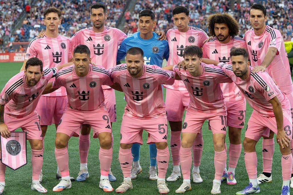 Inter Miami CF players posing for a team photo before an MLS match, wearing their iconic pink kits.